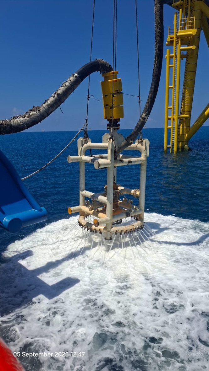 Mass-flow excavator deployed alongside TPCII jacket