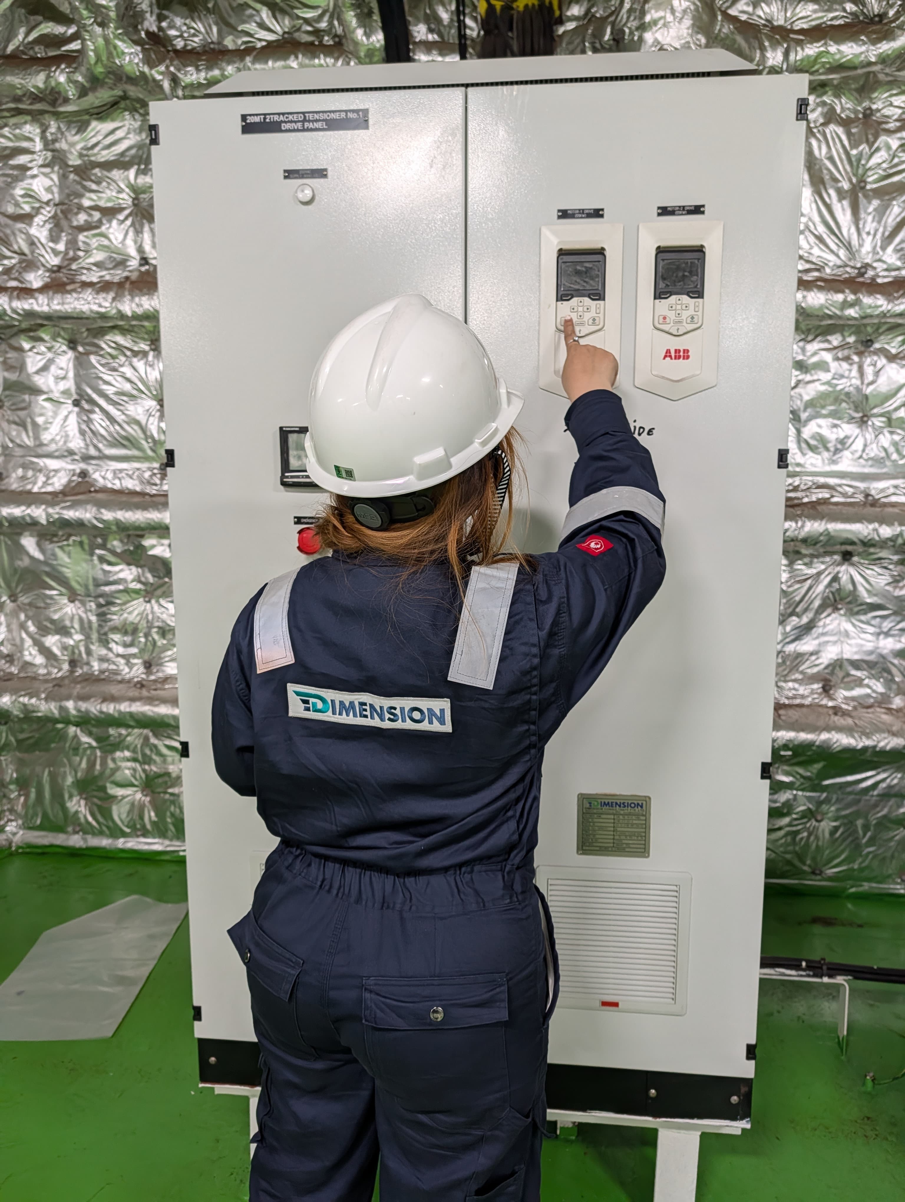 Dimension engineer at the 20 MT 2-Tracked Tensioner No. 1 Drive Panel — ABB ACS880 VFD drives with HMI keypads, Dimension-fabricated cabinet